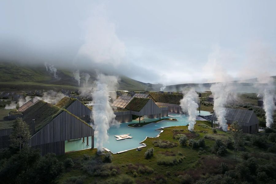 Steaming geothermal lagoon with turf-roofed buildings in a green Icelandic valley