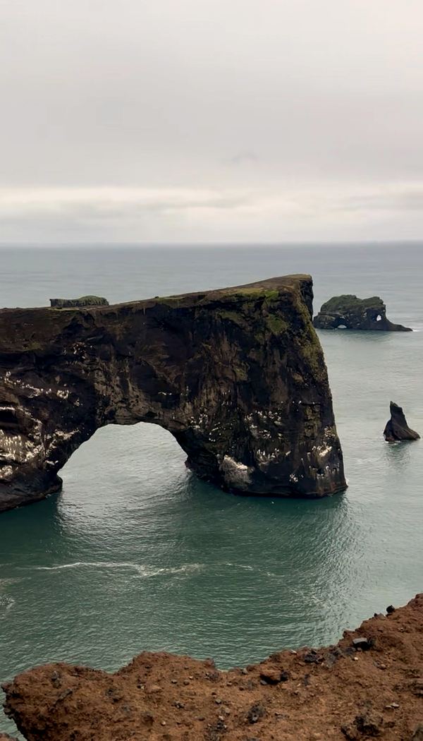 The Dyrhólaey rock arch over the sea